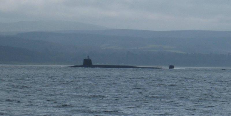 Guardian of the deep: A Royal Navy Vanguard Class Trident missile equipped submarine in the Clyde heading for its base at Faslane- a necessity or a waste of money depending on your point of view. Photo of Guardian of the deep