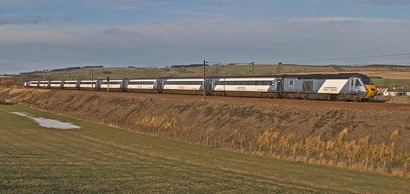 East Coast HST at Reston: A fine winters morning on Saturday 19th December 2009. A HST in East Coast livery drifts downhill towards Ayton and Burnmouth. A front is building in the background heralding the arrival of snow! Photo of East Coast HST at Reston