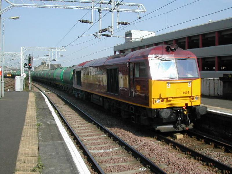 66031: 66031 heads through Paisley Gilmour Street with aviation fuel tanks for Prestwick Airport Photo of 66031
