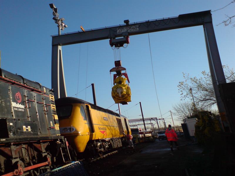 New engine being fitted 1: In my recent truck driving days I was doing a delivery to a Railtrack Yard somewhere in Edinburgh. Got lucky and saw this going on. Photo of New engine being fitted 1