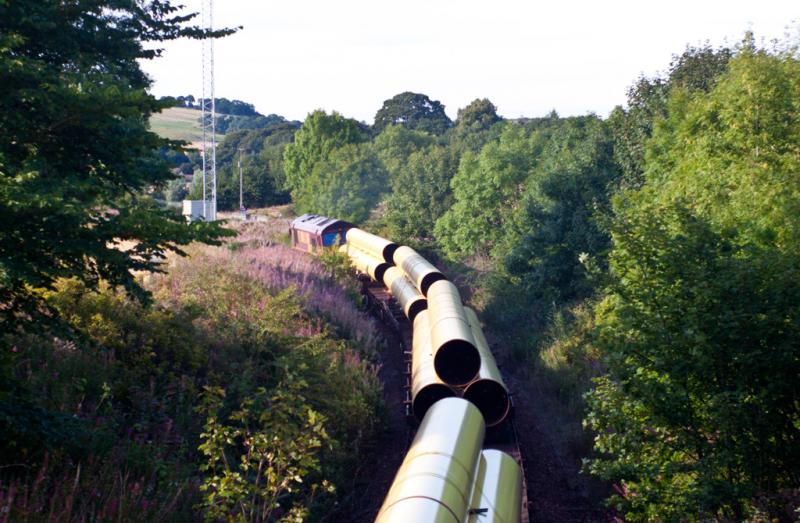 Collessie: This is the view facing the other way from the over bridge at Collessie. 66100 on the pipe train. 31/8/10 Photo of Collessie