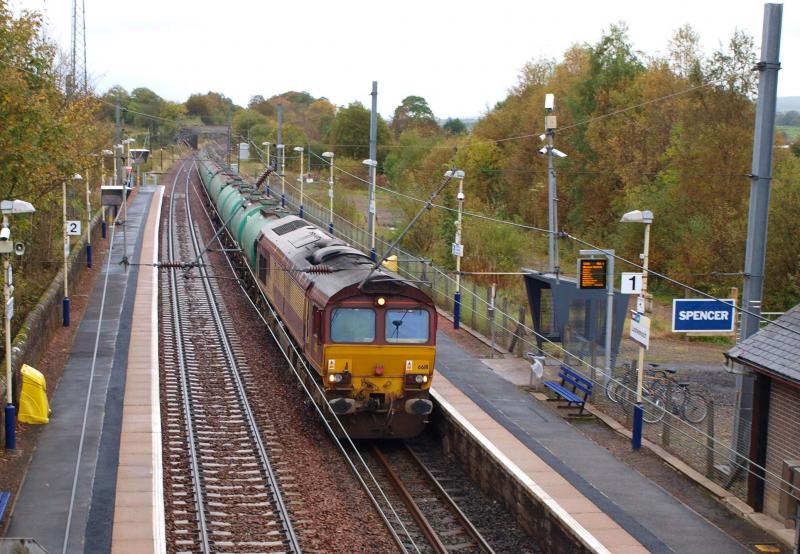 Lochwinnoch - 15-10-2010: 66111 passes Lochwinnoch station with the Prestwick Airport to Grangemouth empty aviation fuel tankers. Photo of Lochwinnoch - 15-10-2010