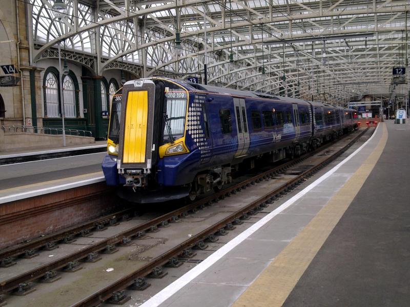 380103: With deliveries of ScotRail's 380s now in full swing more diagrams are starting to appear in passenger service. Here 380103 awaits departure from Glasgow Central with the 1450 departure to Wemyss Bay on Thursday 14th April 2011. Photo of 380103