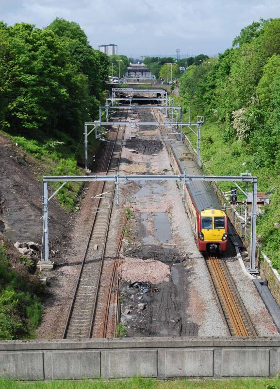 Paieley Corridor Up-grade Bellahouston: 334026 passes through th Bellahouston cutting heading to Glasgow Central
Some of the preparitory work for the upgrage can be seen on the left Photo of Paieley Corridor Up-grade Bellahouston